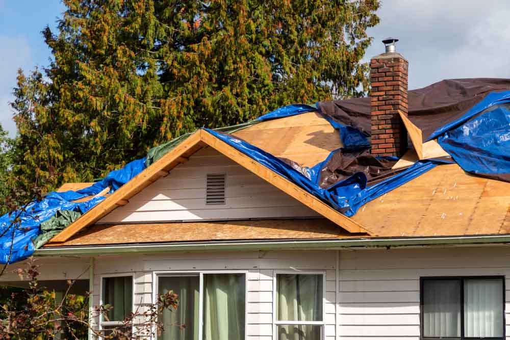 Damaged roof being repaired Hendersonville, NC